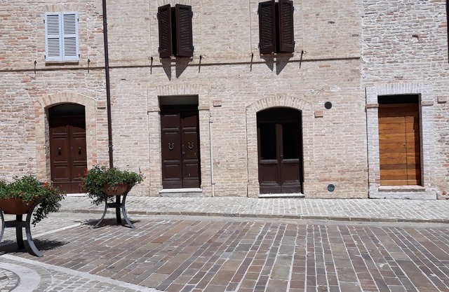 apartment in an ancient medieval building in the central square of Moresco