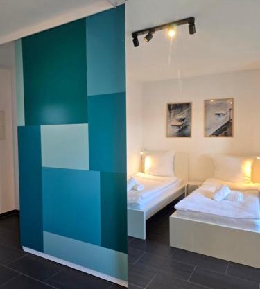APARTMENT PD23 ALTE FEUERWACHE I Ganze Wohnung I 5 Einzelbetten I 3 Zimmer I 3min CityHospital I 50m Supermarkt I Küche I SmartTV