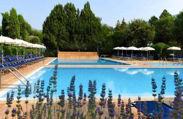 Apartment surrounded by greenery with swimming pool