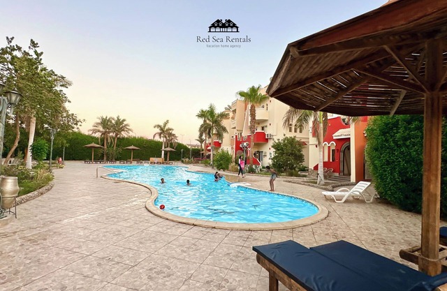 Apartment with a big swimming pool and balcony