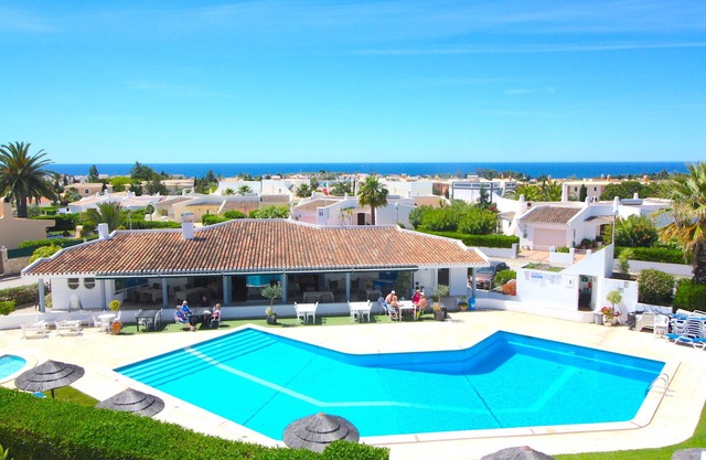 Apartment with communal pool walking distance to amenities, beach, town center
