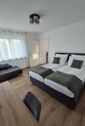 Apartments Seibel Doppel-Zweibettzimmer mit Küche und Wintergarten