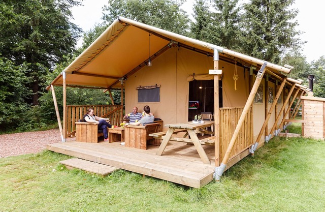 Atmospheric glamping tent with bathroom in nature