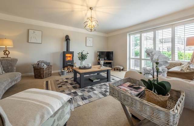 Attractive chalet style brick and flint barn with a sunny, south facing garden
