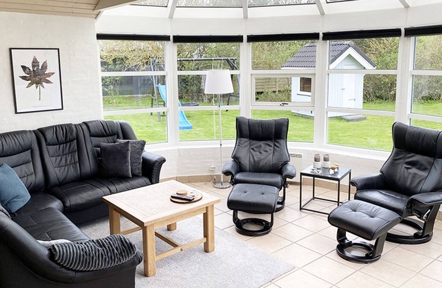 Attractive holiday home on a lawn, with window front including WiFi, annex
