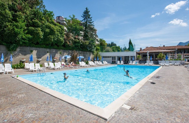 Attractive studio with terrace, garden, air conditioning, pool and dream lake view