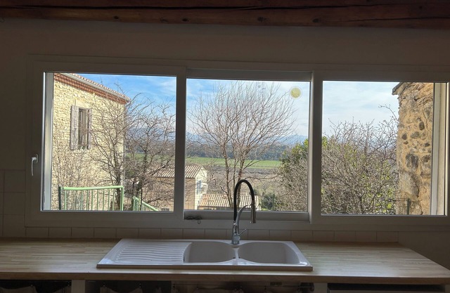 Atypical village house with terrace and garden near Grignan.