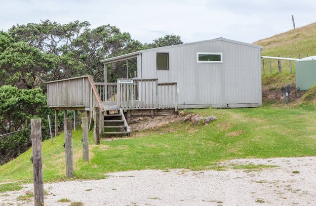 Basic holiday cabin with its own private sandy bay