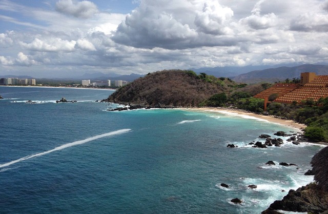 Bask in mesmerizing 180º ocean views and relax in this tasteful 2 story condo