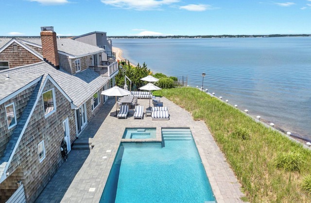 Bayfront Luxury Retreat with Heated Pool, Private Beach, and Sweeping Water.