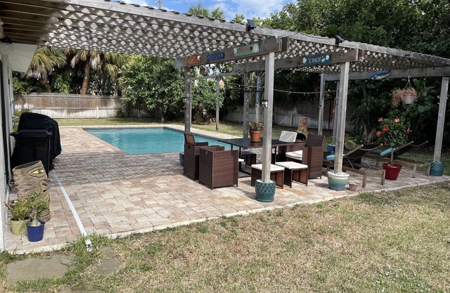 Beach house with HEATED pool one block from the beach!