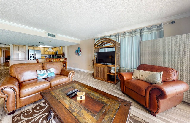 Beachfront condo with pool, hot tub, balcony, & grill