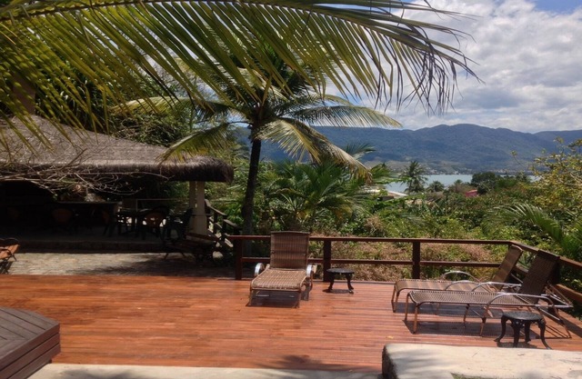 Beachfront house with sea and mountain views