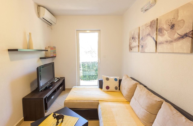 Beachfront One Bedroom Apartment with balcony and backyard view