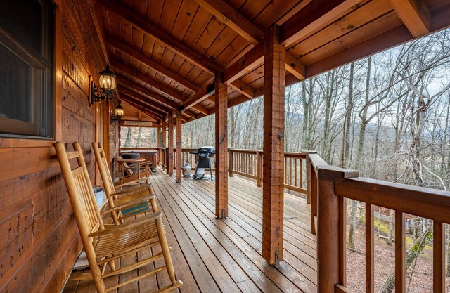 Beautiful cabin nestled among the trees, featuring a loft and relaxing hot tub.