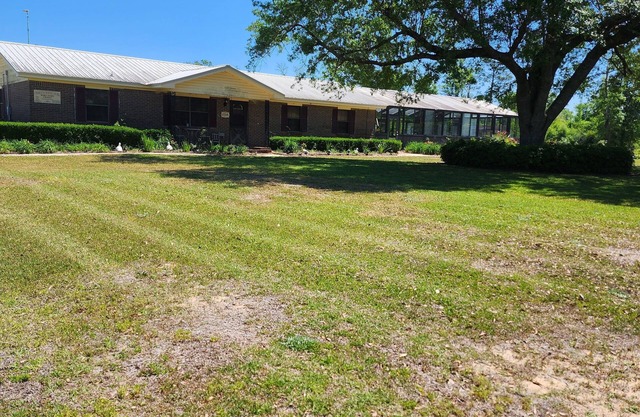 Beautiful country home in quiet setting. Surrounded by gorgeous gardens.