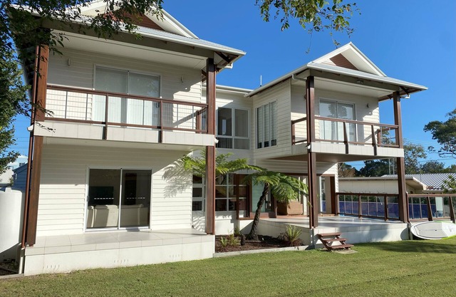 Beautiful family beach house with pool, adjacent to the bays best swimming beach