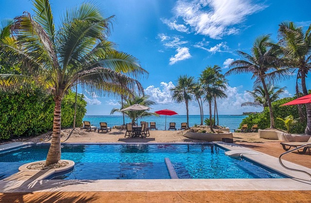 Beautiful ground level beachfront condo with AC, private terrace with pool!