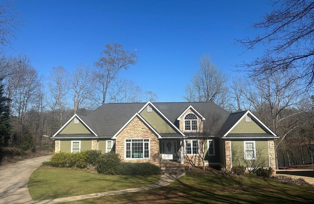 Beautiful lakefront home on over an acre with lots of room, views, and amenities