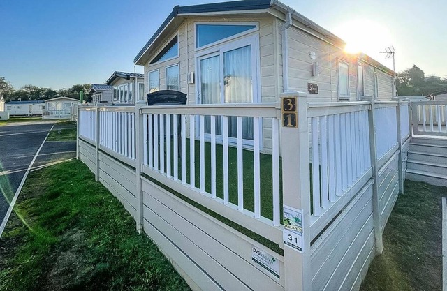 Beautiful lodge with decking at Oaklands Holiday Park in Essex ref 39031BG