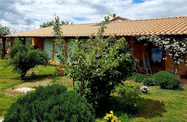 Beautiful straw bale house between organic vineyards and olive grove