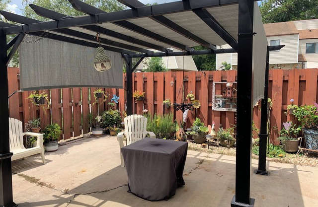 Beautiful unfurnished townhome that includes a patio with a pergola and fire pit