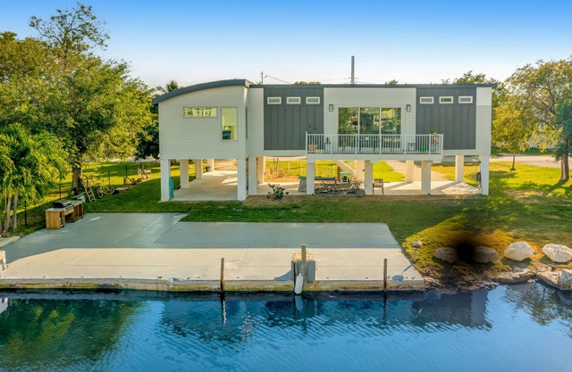 Beautiful waterfront home with central AC, dock, lovely balcony & patio
