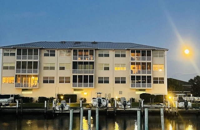 Beautiful waterfront 2-bdrm condo with Executive Office & Boat Lift.