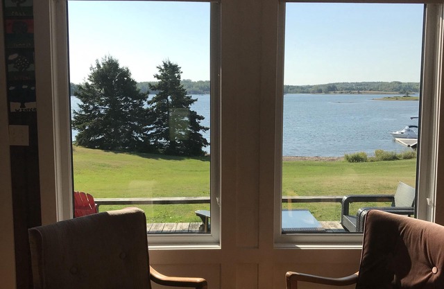Beautiful waterfront property with large deck, lovely gazebo, and private dock.