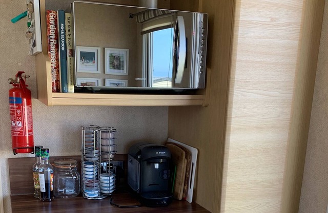 Beautifully decorated caravan right next to the sea with picturesque views