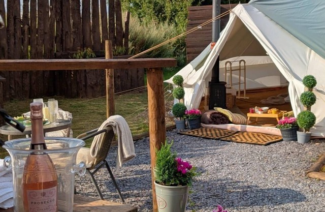 Bell tent in ultimate luxury with a wood fired hot tub, super king size bed