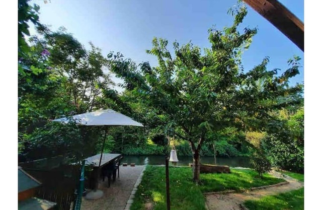 Between town & country (garden with river)