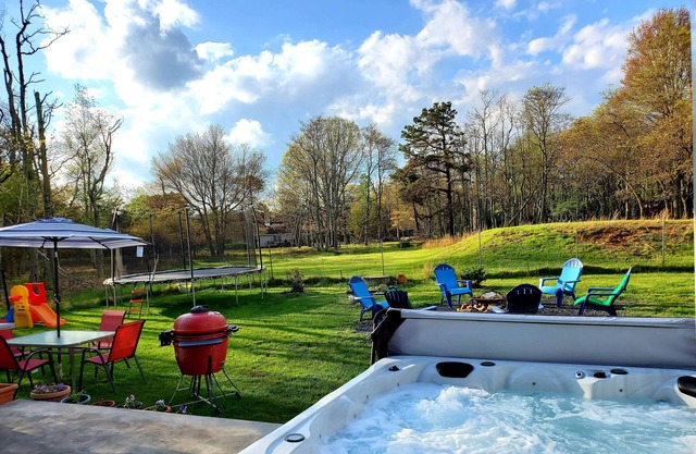 Big house, hot tub, sauna, fireplace trampoline, fire pit.