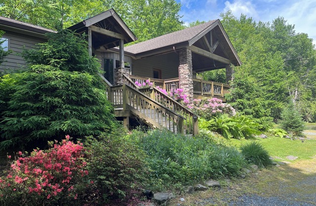 Blowing Rock Retreat near Julian Price Park with stream and pond.