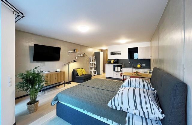 Bonquartier | Design apartment with balcony, parking space + charging station