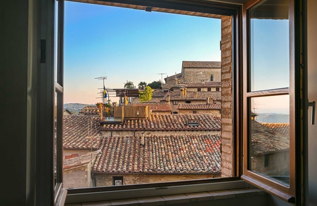 Boutique apartment with balcony, pool & valley views in idyllic hill-top village