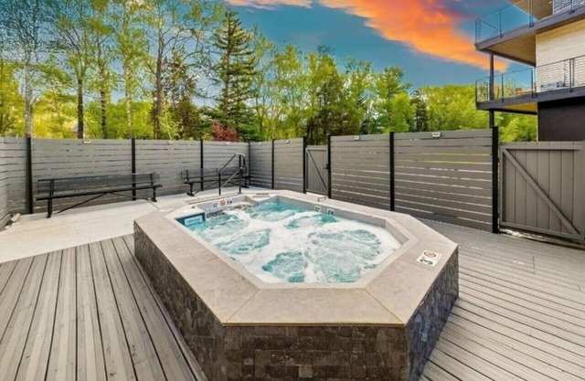 Brand new property with hot tub, fire pit, parking, covered ski storage, and more!