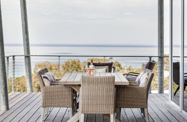 BREATHTAKING VIEWS OVER THE TREETOPS TO THE AZURE WATERS OF THE BAY.