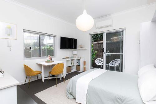 Bright Beachfront Studio with Terrace & Aircon