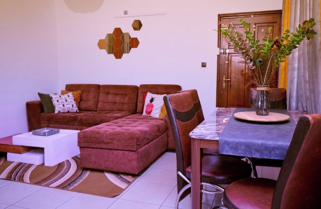 Bright, cozy apartment, where mustard yellow creates a warm ambience.
