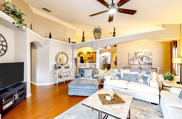 Bright home with an enclosed pool, patio, Ping-Pong table, foosball, and AC