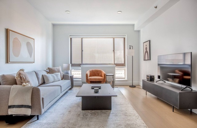 Bright Midtown 2BR w/W/D, Gym & Doorman, nr Times Sq, by Blueground