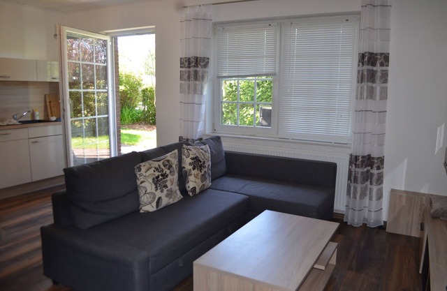 Bright, spacious comfort apartment with private garden and walk-in shower.