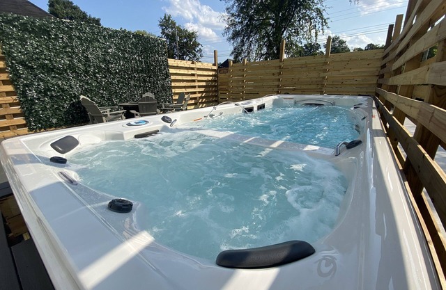 Bright stylish home minutes to downtown! New build with HUGE pool/hot tub combo!