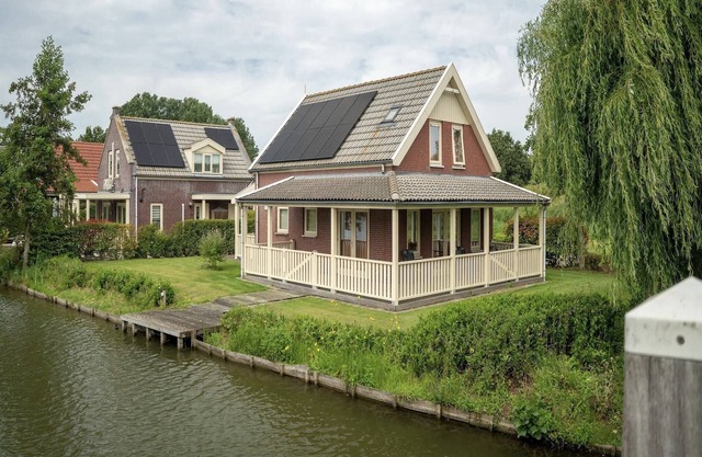 Bungalow by Water near Rotterdam with Sauna