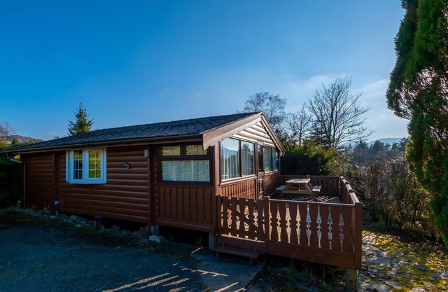 Cabin 310 is a pet-friendly, bronze graded, 3-bedroom self-catering log cabin sleeping 6 people (1 d
