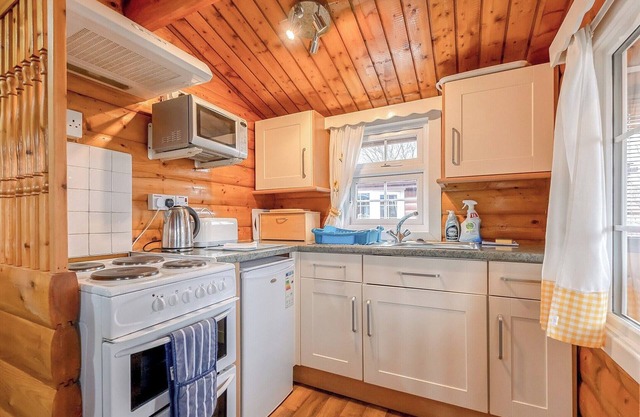 Cabin 329 is a pet friendly, gold graded, 2-bedroom self-catering log cabin sleeping 4 people (1 dou