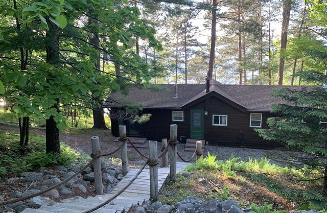 Cabin Nestled Amongst Towering Pines Bluff Overlooking nMain Body of Woman Lake