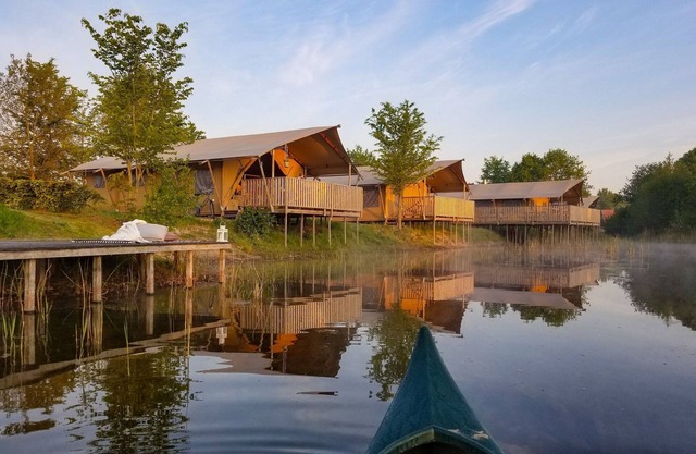 Campsite - Combined Tents With Kitchen and Bathroom Located Near a Pond