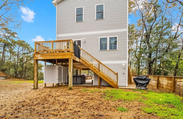Canal-view, dog-friendly home with private hot tub, deck & grill - near beach
